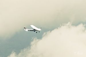 Atl text=cessna 172 flying in the clouds