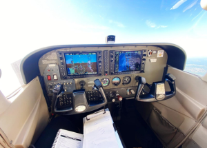 Garmin g1000 cockpit view of a cessna 172 flying over Atlanta, Georgia